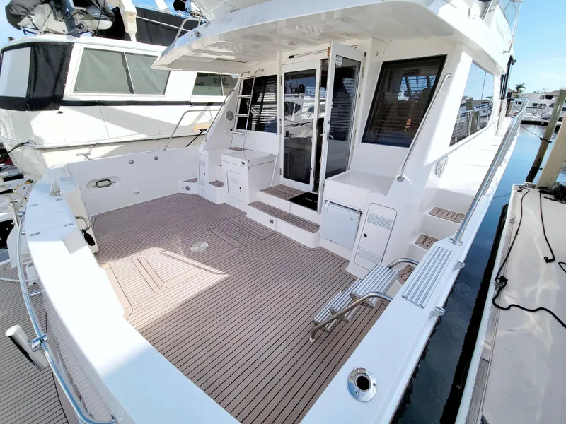 Slide: The Image of 1999 West Bay 58 Sonship yacht with spacious deck and modern design. - 16