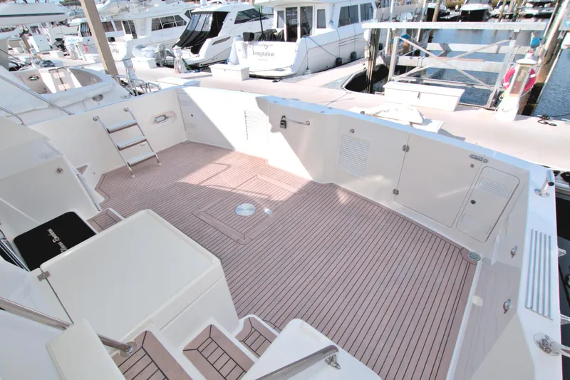 Slide: The Image of 1999 West Bay 58 Sonship yacht deck with spacious seating and modern design. - 36