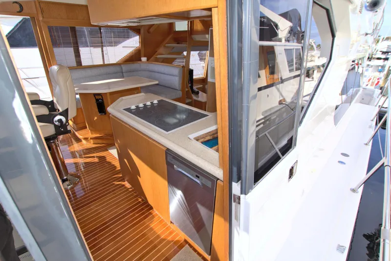 Slide: The Image of Interior view of 1999 West Bay 58 Sonship yacht, featuring modern kitchen and seating area. - 47