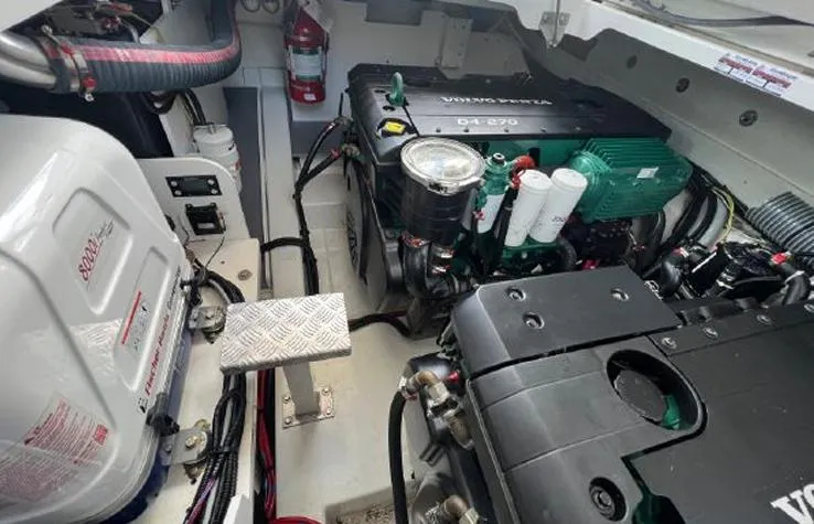 Slide: The Image of Engine room of 2020 Jeanneau NC 37 boat with Volvo Penta engine and fire extinguisher. - 19