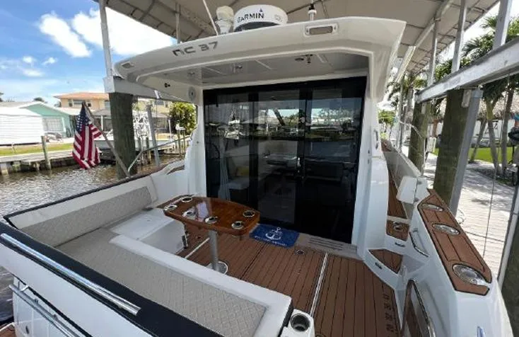 Slide: The Image of 2020 Jeanneau NC 37 yacht with spacious deck and seating area. - 3