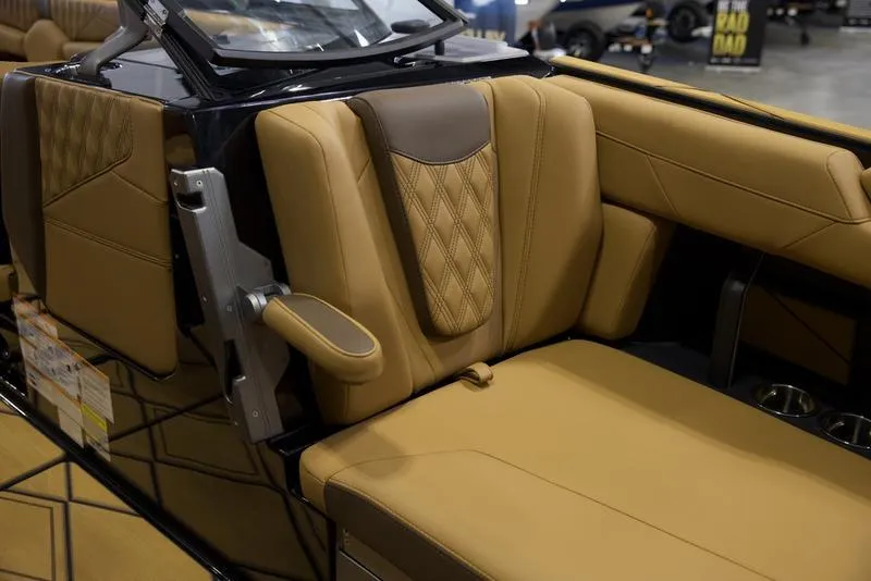 Slide: The Image of Luxurious interior of 2025 Malibu M242 boat with tan leather seating. - 18