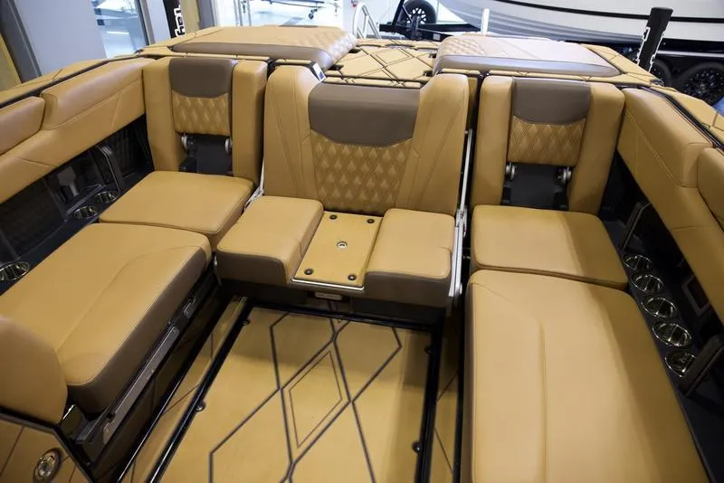 Slide: The Image of Luxurious interior of 2025 Malibu M242 boat with tan leather seating and modern design. - 25