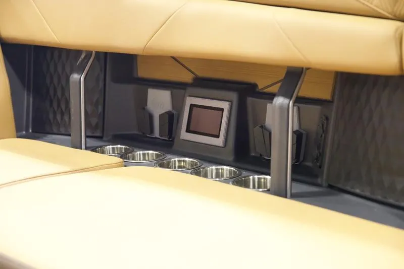 Slide: The Image of 2025 Malibu M242 interior with cup holders and control panel. - 30