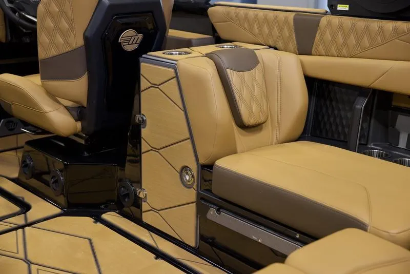 Slide: The Image of Luxurious interior of 2025 Malibu M242 boat with tan leather seating and modern design. - 31