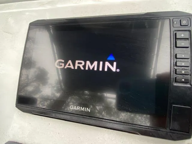 Slide: The Image of Garmin display on 2023 Dargel 250Kat HDX boat, showing startup screen. - 15