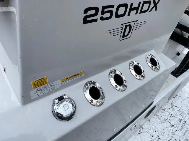 Slide: The Image of 2023 Dargel 250Kat HDX boat detail with rod holders and branding. - 19