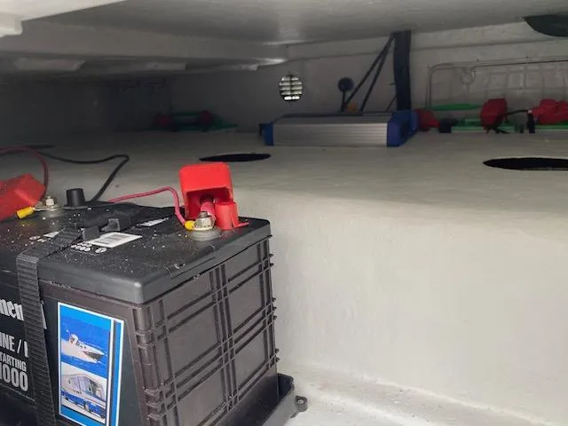 Slide: The Image of Battery compartment of 2023 Dargel 250Kat HDX boat, showing wiring and connections. - 25