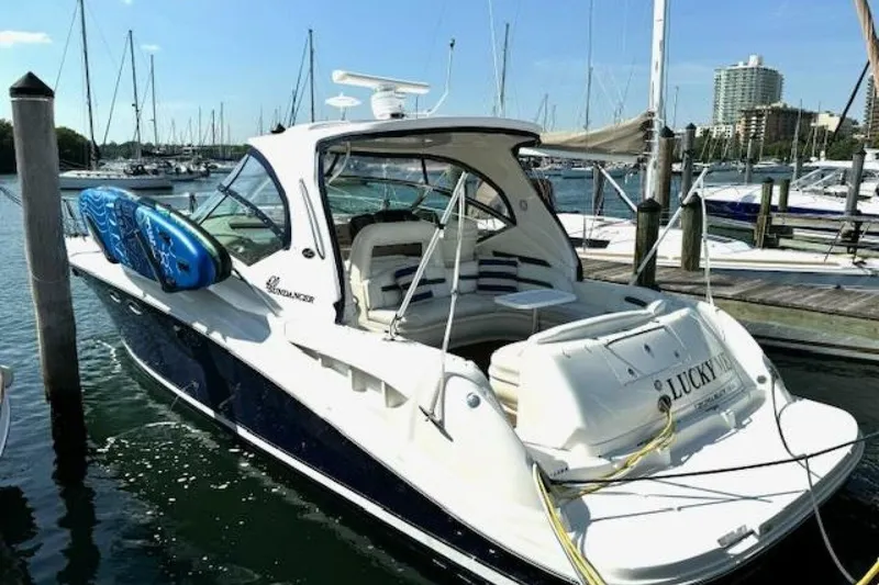 Slide: The Image of 2003 Sea Ray 420 Sundancer yacht named "Lucky Me" docked at marina. - 13