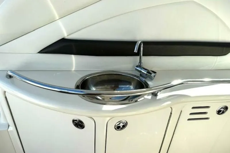 Slide: The Image of Luxurious seating area on 2003 Sea Ray 420 Sundancer yacht with white cushions and table. - 16