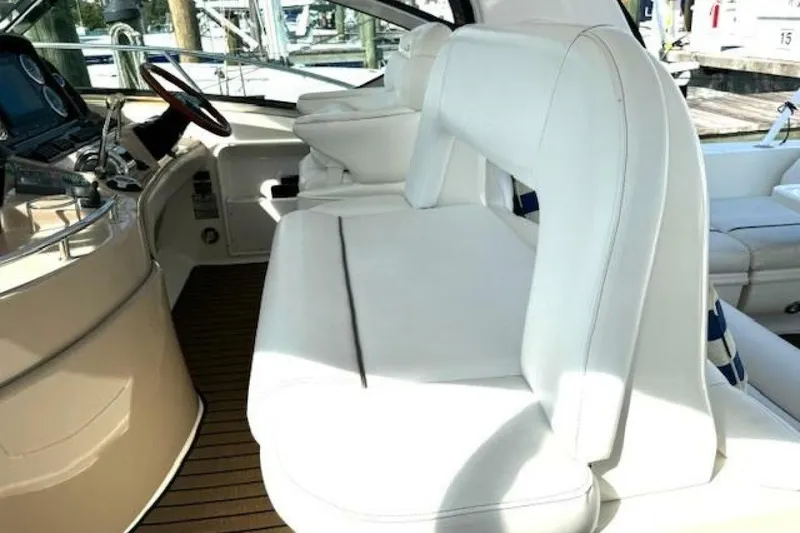 Slide: The Image of Bow view of 2003 Sea Ray 420 Sundancer yacht on calm water. - 23