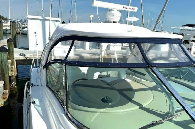 Slide: The Image of Engine compartment of 2003 Sea Ray 420 Sundancer with visible hoses and components. - 34