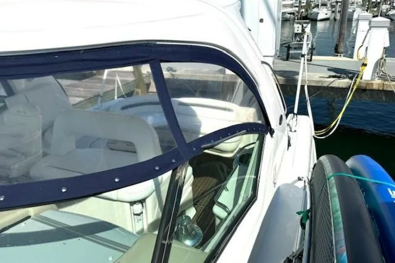 Slide: The Image of 2003 Sea Ray 420 Sundancer yacht docked at marina with clear blue skies. - 35