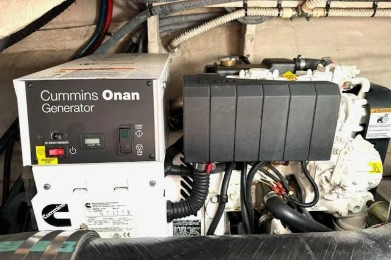 Slide: The Image of 2003 Sea Ray 420 Sundancer yacht docked, named "Lucky Me," in a marina setting. - 4