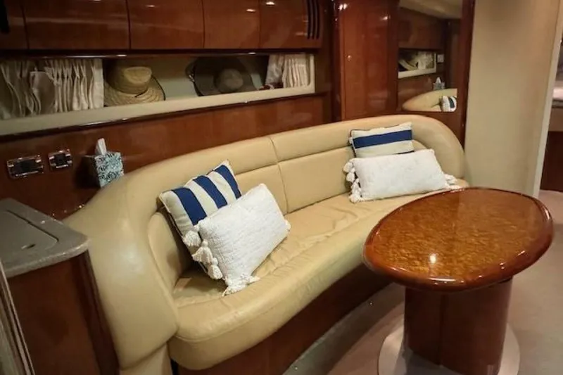 Slide: The Image of Luxurious interior of 2003 Sea Ray 420 Sundancer yacht with elegant seating and kitchenette. - 41