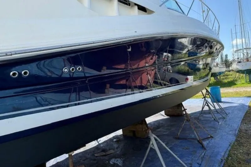 Slide: The Image of Close-up of 2003 Sea Ray 420 Sundancer trim tab and hydraulic actuator. - 52