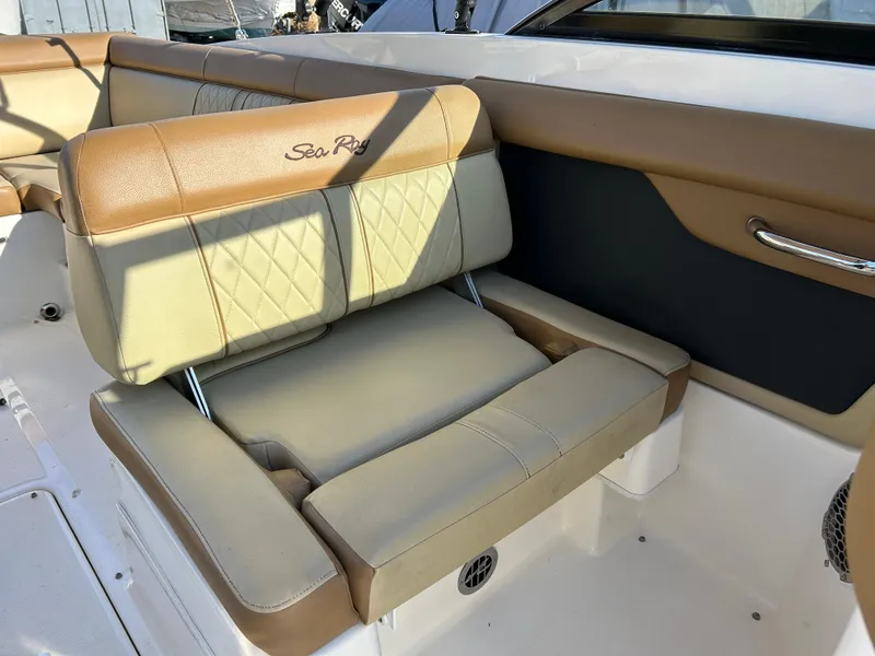 Slide: The Image of 2015 Sea Ray 270 Sundeck boat seating with tan upholstery and diamond stitching. - 11