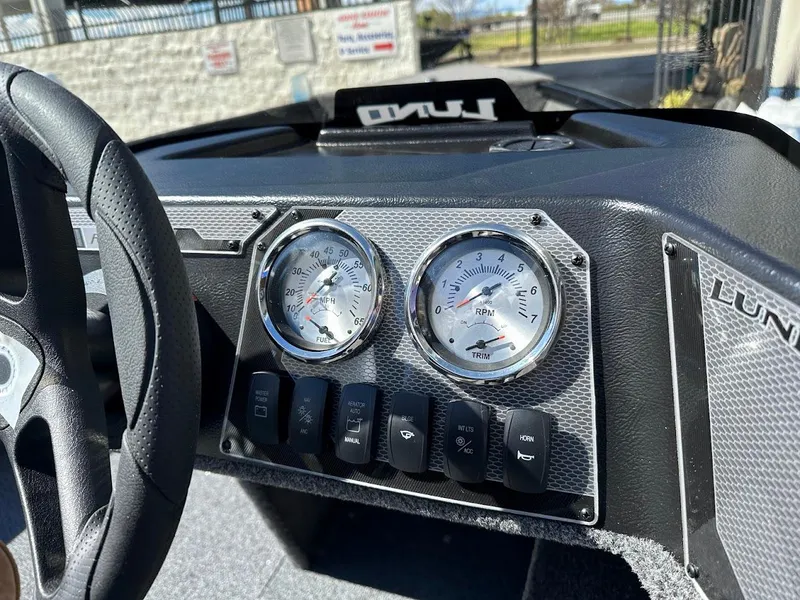 Slide: The Image of Dashboard of 2025 Lund 1650 Rebel XL SS boat with gauges and controls. - 19