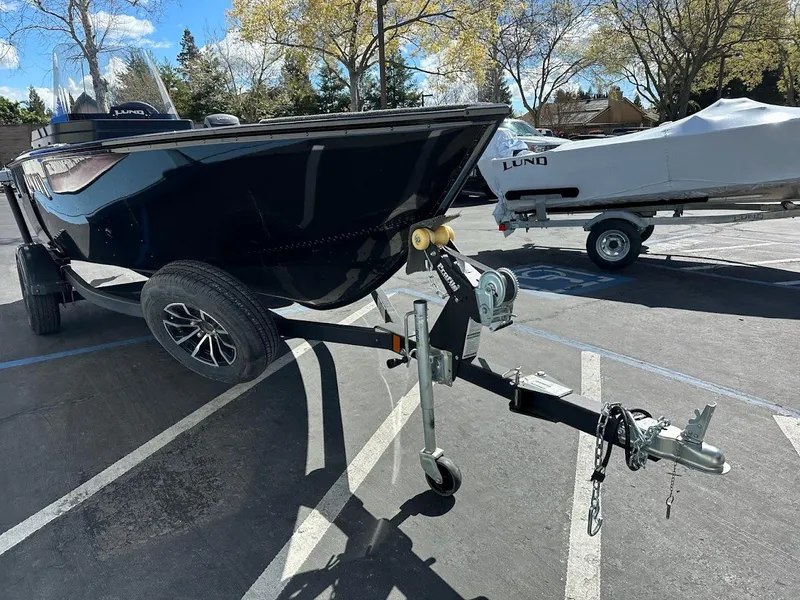 Slide: The Image of 2025 Lund 1650 Rebel XL SS boat on trailer in parking lot. - 4