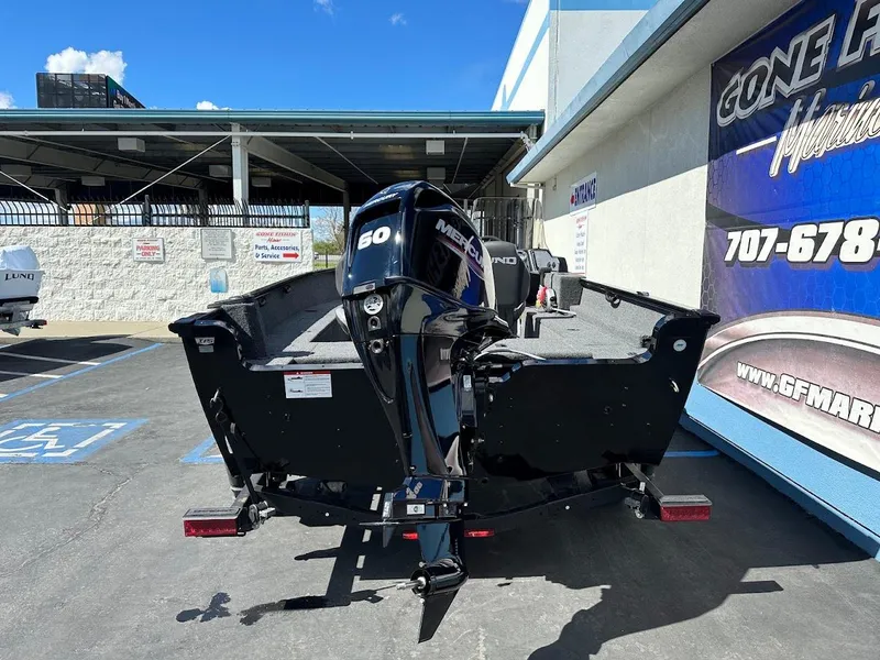 Slide: The Image of 2025 Lund 1650 Rebel XL SS boat with Mercury 60 engine in parking lot. - 8