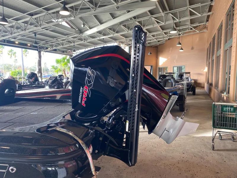 Slide: The Image of 2021 Nitro Z21 boat with powerful engine in a covered storage area. - 2