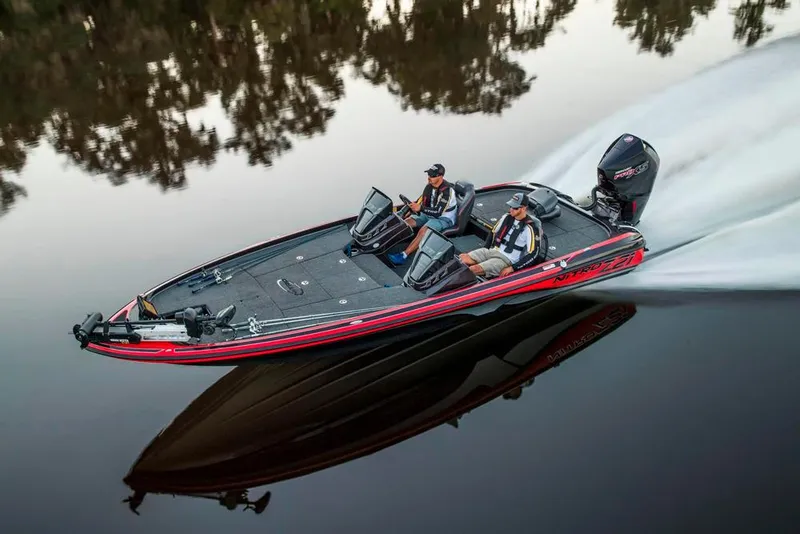 Slide: The Image of 2021 Nitro Z21 boat speeding on calm water, reflecting trees. - 9