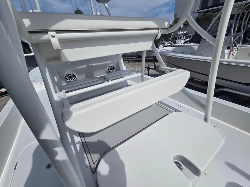Slide: The Image of 2024 Shallow Sport X3 boat interior with seating and storage compartments. - 13