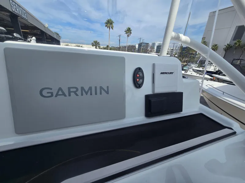 Slide: The Image of 2024 Shallow Sport X3 boat dashboard with Garmin and Mercury equipment. - 14