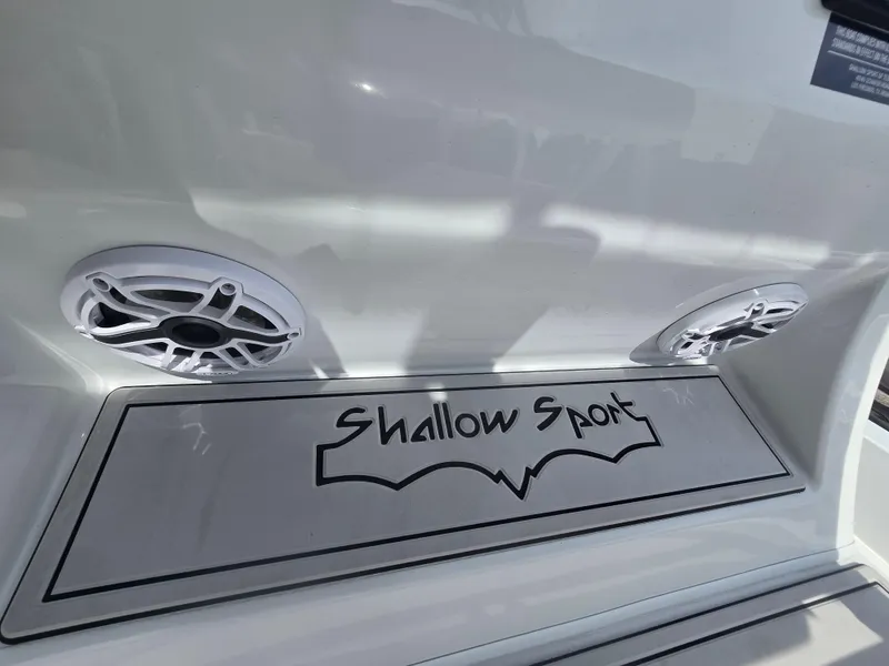 Slide: The Image of 2024 Shallow Sport X3 boat with speakers and logo detail. - 15