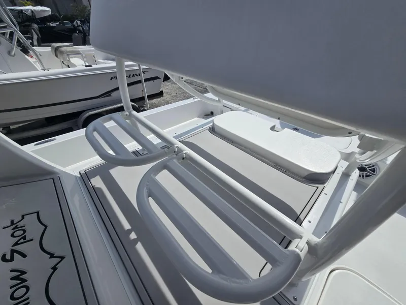 Slide: The Image of 2024 Shallow Sport X3 boat interior with seating and storage compartments. - 16