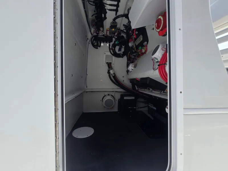 Slide: The Image of 2024 Shallow Sport X3 interior compartment with wiring and equipment. - 20