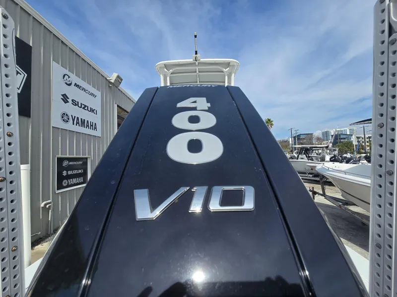 Slide: The Image of 2024 Shallow Sport X3 boat with 400 V10 engine, displayed outdoors. - 24