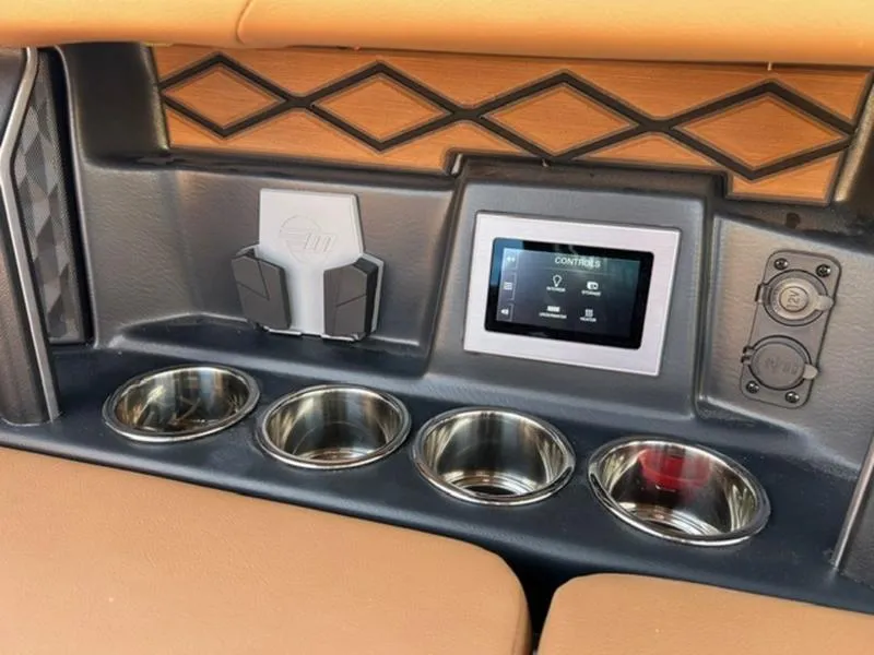 Slide: The Image of 2025 Malibu M230 interior with touchscreen, cup holders, and sleek design. - 16