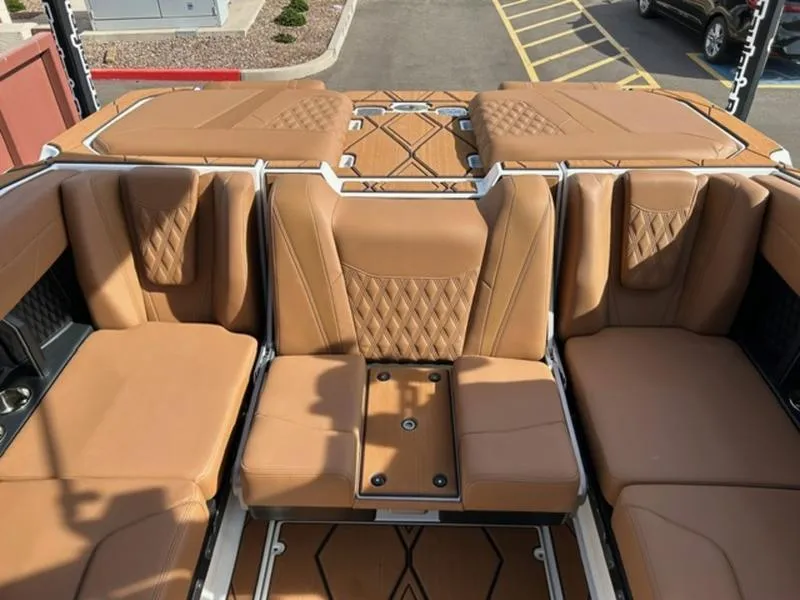 Slide: The Image of Luxurious interior of 2025 Malibu M230 boat with tan leather seating. - 20