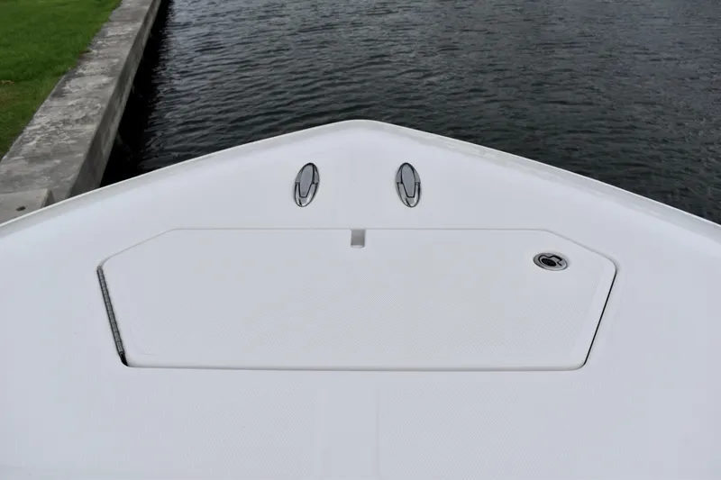 Slide: The Image of Bow of 2013 Invincible 42 Open Fisherman boat on calm water. - 18