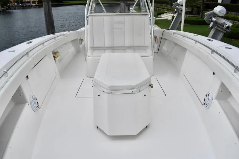 Slide: The Image of 2013 Invincible 42 Open Fisherman boat interior, featuring spacious seating and storage. - 20