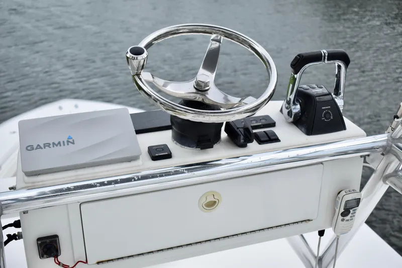 Slide: The Image of Control panel of 2013 Invincible 42 Open Fisherman with Garmin navigation system. - 27