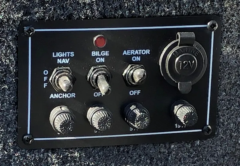 Slide: The Image of Control panel with switches, fuses and 12V outlet. - 11