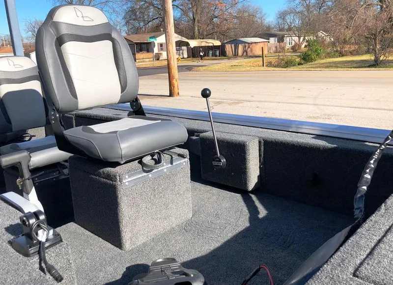 Slide: The Image of 2025 Lowe Skorpion Stick Steer interior with seating and steering control lever. - 4