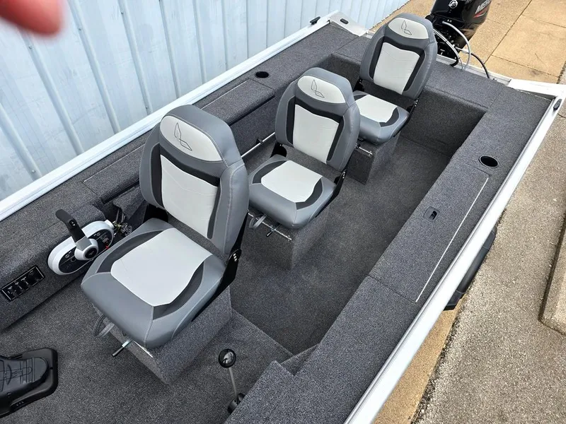 Slide: The Image of 2025 Lowe Skorpion Stick Steer interior with three fishing seats that have storage boxes below. - 5