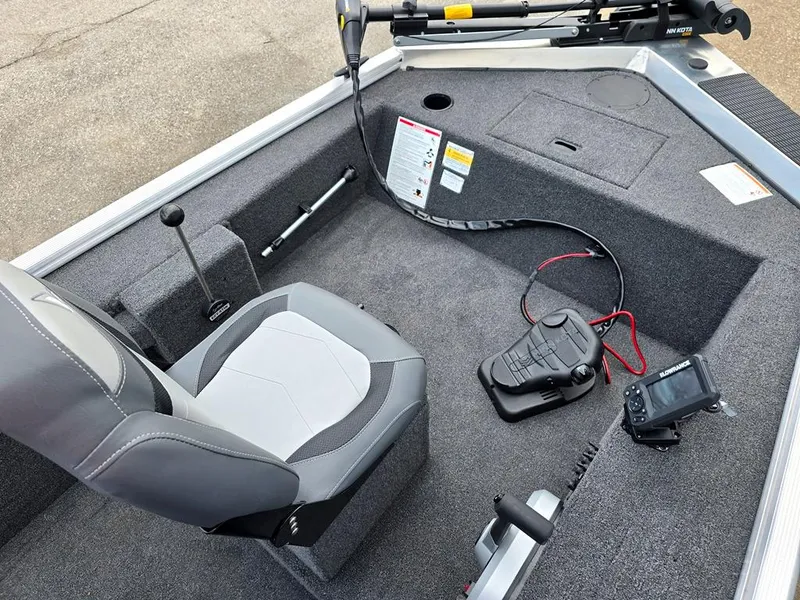 Slide: The Image of Front interior with steering, remote controls, storage and seating. - 8