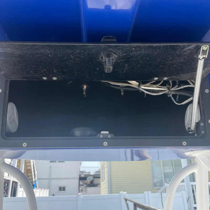 Slide: The Image of Open storage compartment on a 2015 NauticStar 2200XS Offshore boat. - 10