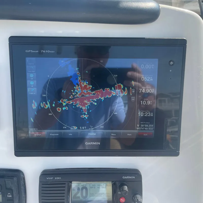 Slide: The Image of Garmin GPS display on 2015 NauticStar 2200XS Offshore boat dashboard. - 12