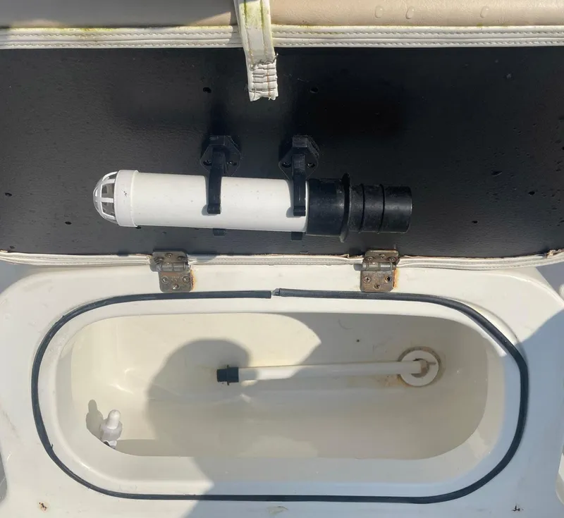 Slide: The Image of Open storage compartment on a 2015 NauticStar 2200XS Offshore boat. - 21
