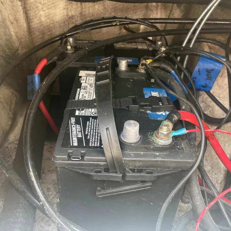 Slide: The Image of Battery compartment of a 2015 NauticStar 2200XS Offshore boat with visible wiring. - 8