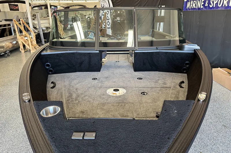 Slide: The Image of 2026 Alumacraft Competitor 185X Sport boat interior with storage compartments open. - 9