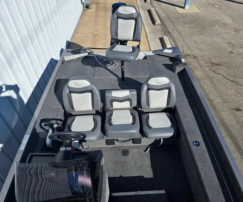 Slide: The Image of 2025 Lowe 1860 Legacy boat interior with gray seating and steering console. - 4