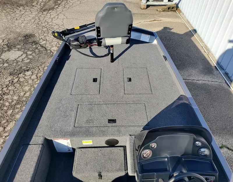 Slide: The Image of 2025 Lowe 1860 Legacy boat interior with seating and storage compartments. - 5