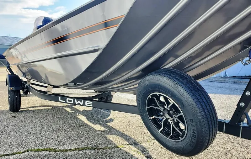 Slide: The Image of 2025 Lowe 1860 Legacy boat on trailer, showcasing sleek design and durable construction. - 7