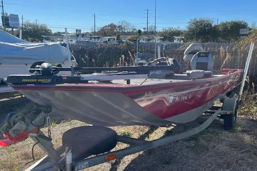 Slide: The Image of 2014 G3 176 EAGLE boat on trailer, red and gray, parked outdoors. - 5